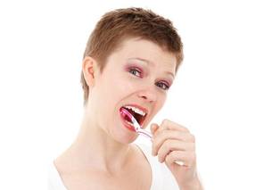 Mary brushes teeth